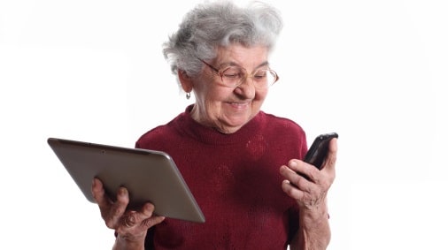 Old lady with tablet PC and smartphone