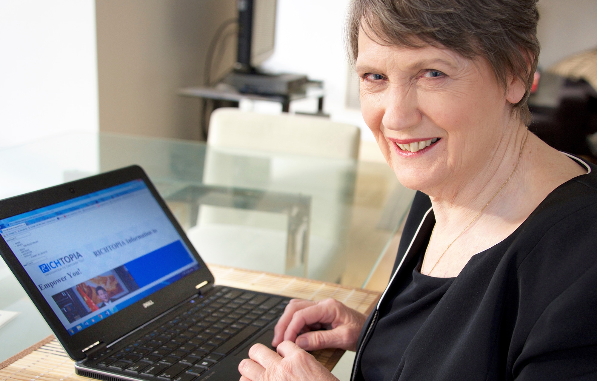 Picture of Helen Clark reading Richtopia.com on her laptop.