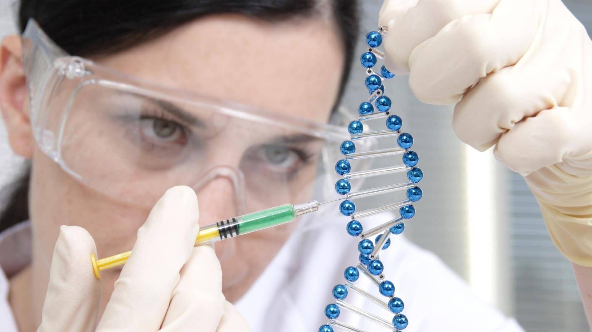 Picture of a woman editing DNA, example of CRISPR technology.