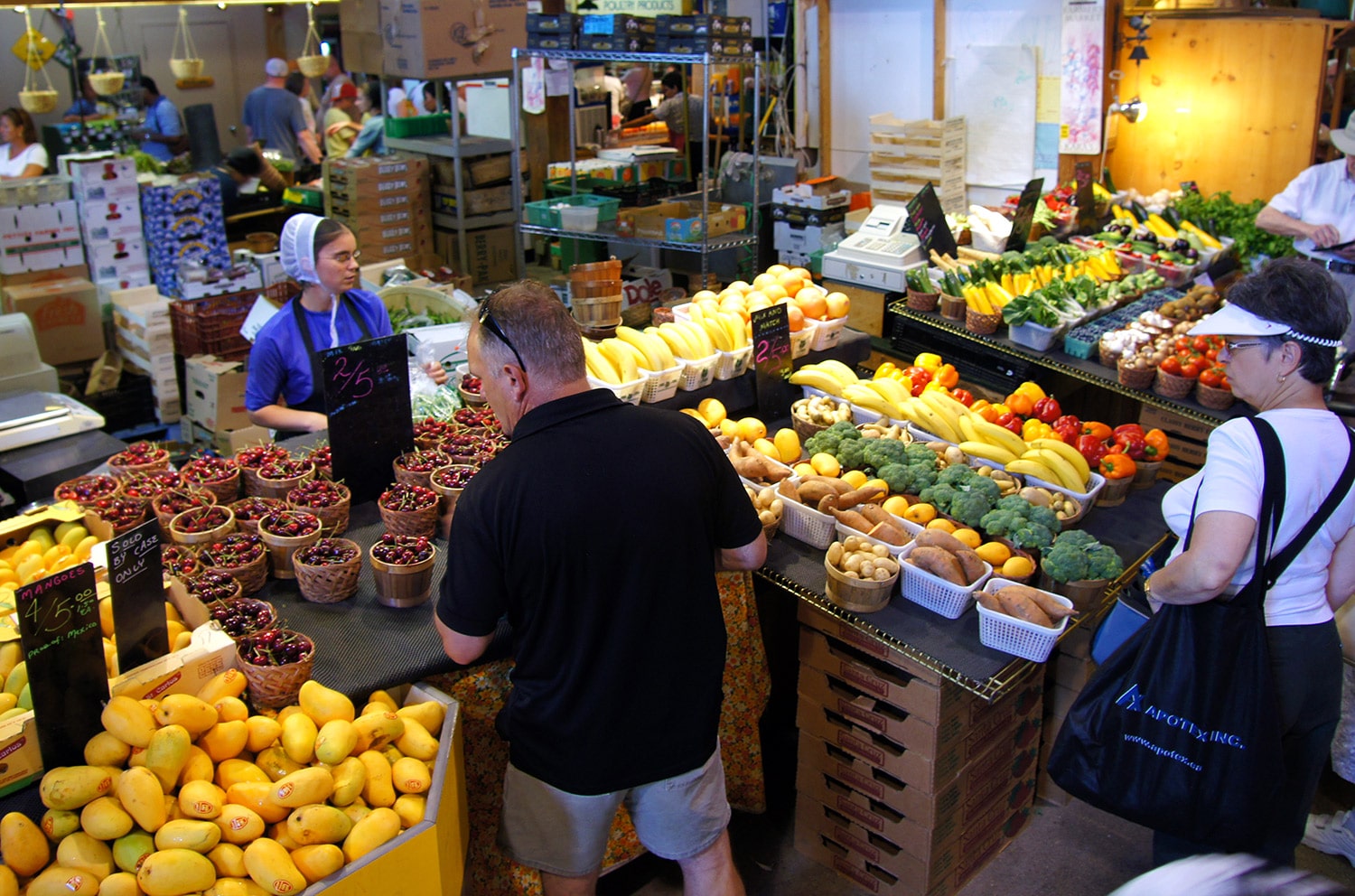 People shopping for vegatables at a local market in New York, USA.
