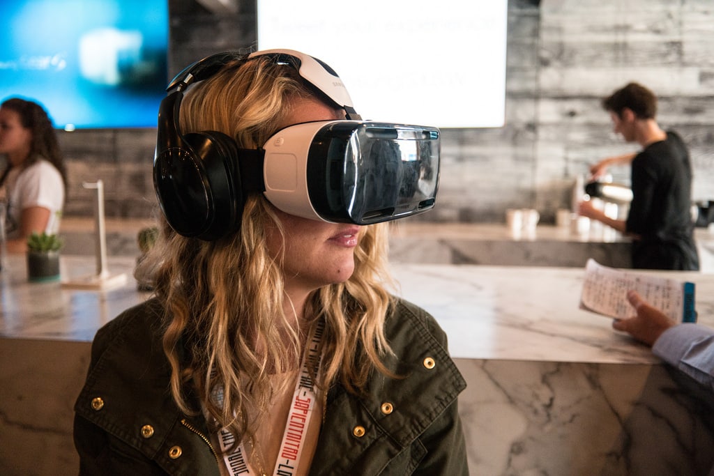 Blonde female teenager testing Virtual Reality