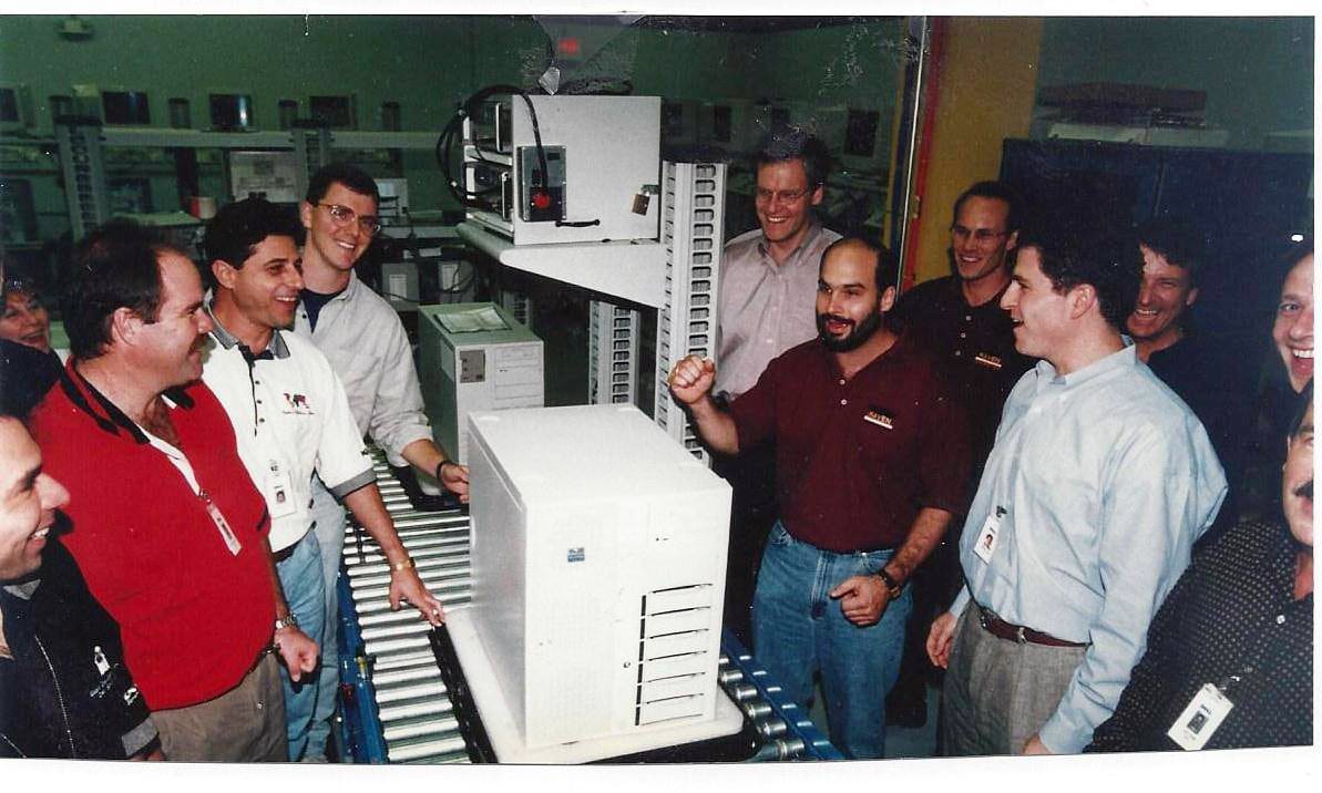 Photo of young Michael Dell and team