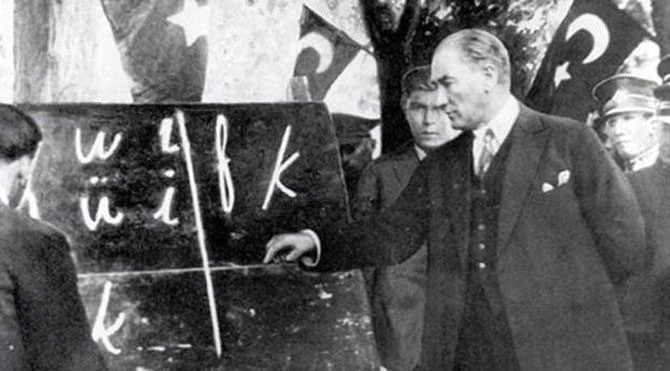 Ataturk teaching the new Turkish alphabet to people