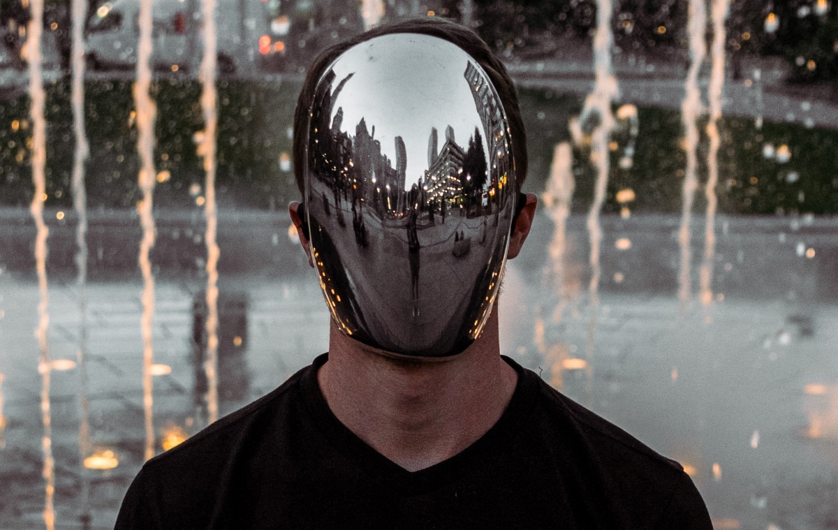 Photo of man wearing a mask in public