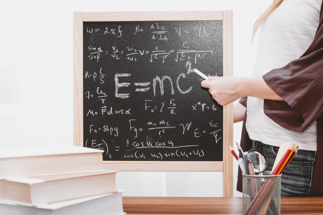 e=mc2 written on a chalkboard