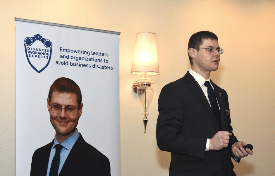 Photo of Gleb Tsipursky speaking to an audience about disaster preparedness.