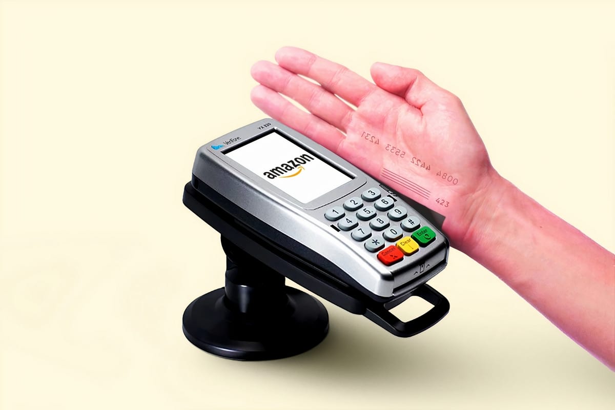 Photo of a person's hand with credit-card style drawings, scanning through an Amazon branded card-reader