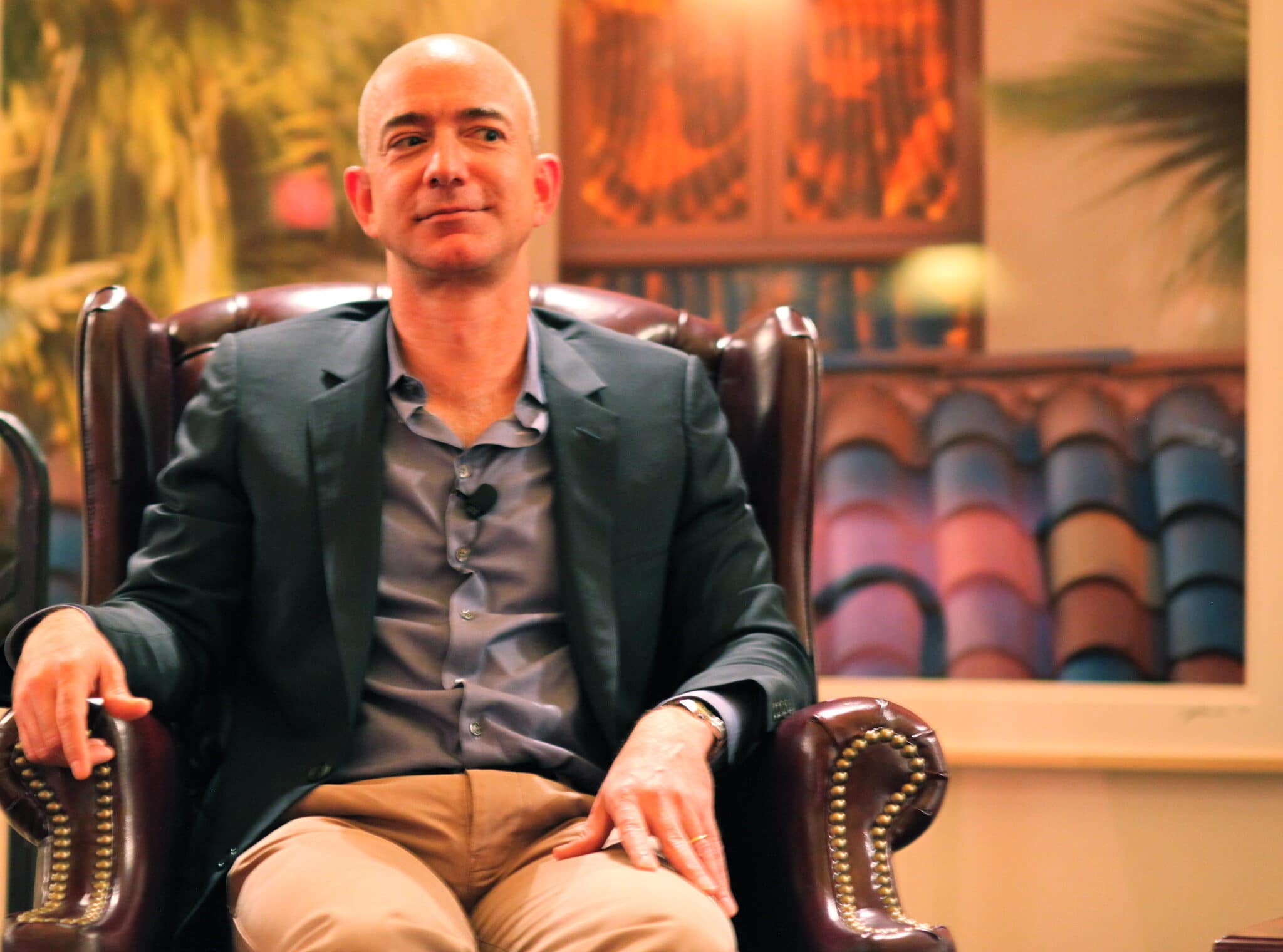 Photo of Jeff Bezos sitting on a victorian leather chair, taken by Steve Jurvetson